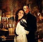 Emmy Rossum, Gerard Butler in <a href=http://archive.salon.com/ent/movies/review/2004/12/22/phantom/cover.jpg>Phantom of the Opera</a>