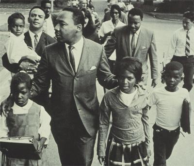 Martin Luther King, Jr. (http://library.agnesscott.edu/images/mlk-with-school-children.jpg)