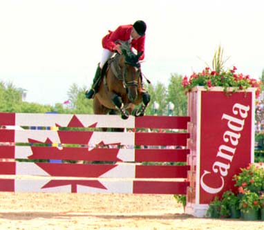 <a href=http://www.keithlevitphotography.com/sports/panam99/images/ian_20Jump1.jpg>Ian Millar jumping over Canada</a>