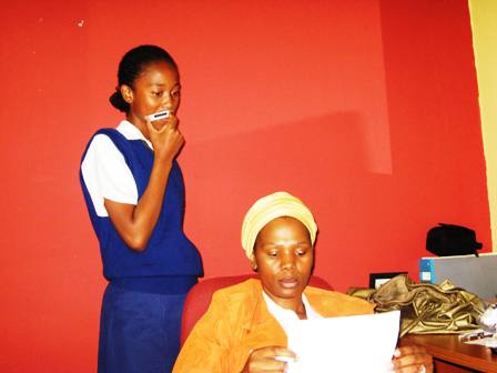 Ziyanda with her daughter Avuyile in her office (I took with my camera)