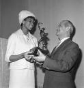 <a href=http://www.africanamericans.com/images2/WilmaRudolph_SullivanAward.jpg>Wilma receiving her trophy</a>