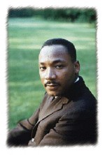 Martin Luther King Jr. sitting on the ground
